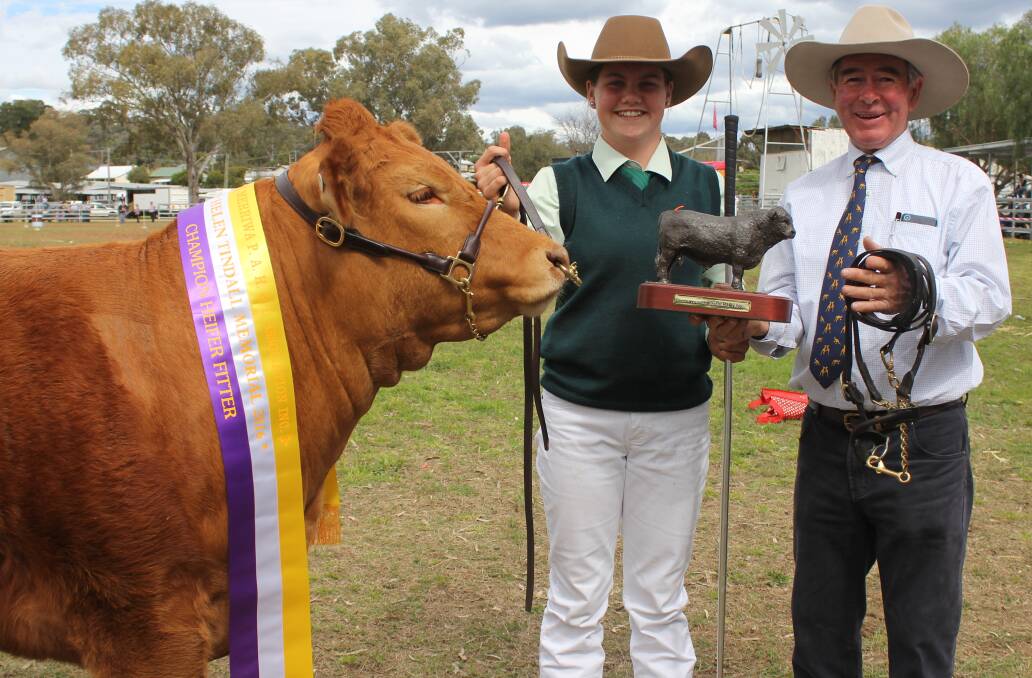 Caitlin Porter receives the Helen Tindall Memorial Trophy for Heifer Fitting from Merriwa Show vice-president, Rob Tindall