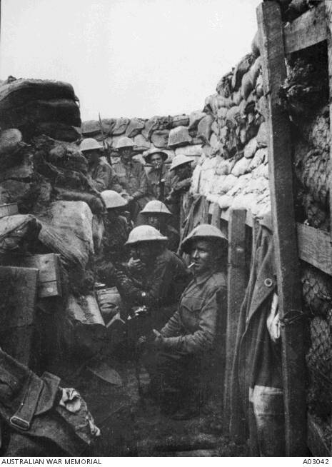 Men of the 53rd Battalion waiting to don their equipment for the attack at Fromelles. Only three of the men shown here came out of the action alive, and those three were badly wounded.

