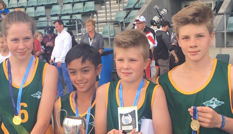 Sweet victory: Holding their gold medals are the state champions, Lucy Nott, Ronnie Baff, Lachlan Gough, Nicholas Gough.