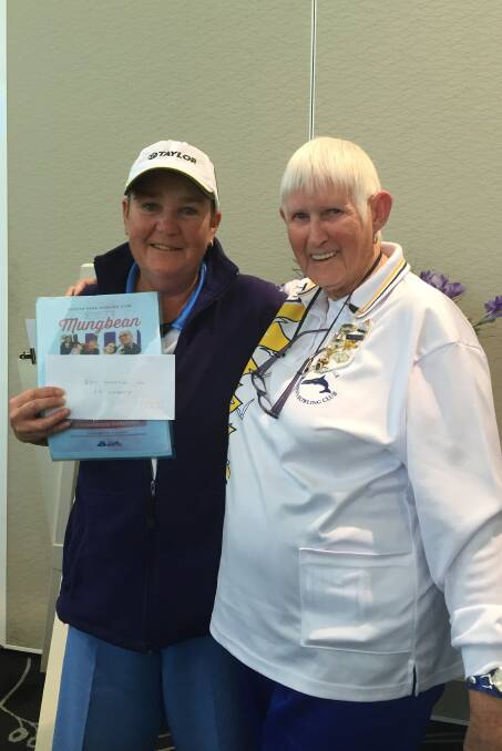 Urunga President, Jean Dew, is pictured presenting Scotts Head representative for Mungbean, Kate Adams, with a donation of $100 from Urunga Womens Bowling Club.
