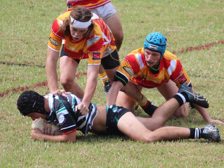 Aaron Rigney being tackled in the Under 18’s match.
