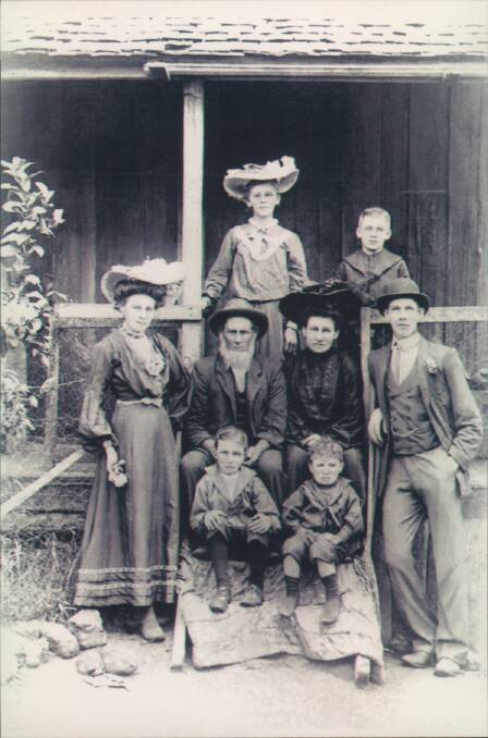 Bernard McNally senior with his family outside McNally House. Photo: Bellingen Museum 04893.