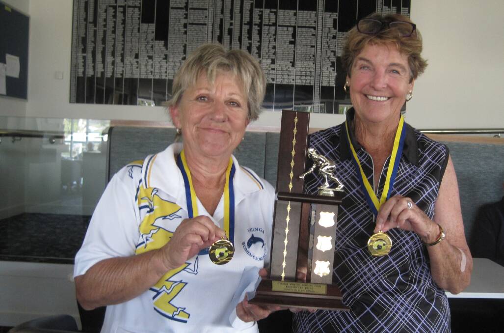 Robyn Adams and Colleen Katen proudly displaying their medallions and the perpetual trophy