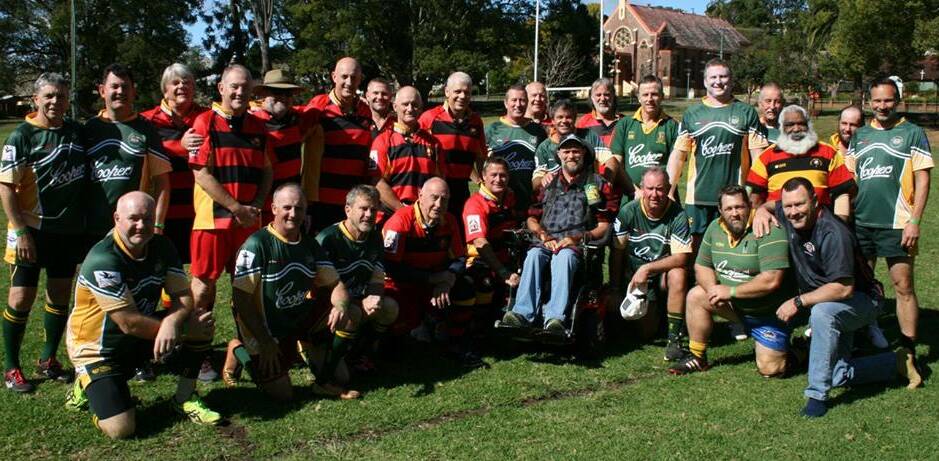 Bellingen, Urunga and Dorrigo Golden Oldies (green jerseys) with the Coffs Harbour Golden Oldies team the Gropers (red jerseys). Front in wheelchair is Al McCab, who was injured in a rugby accident and still plays.