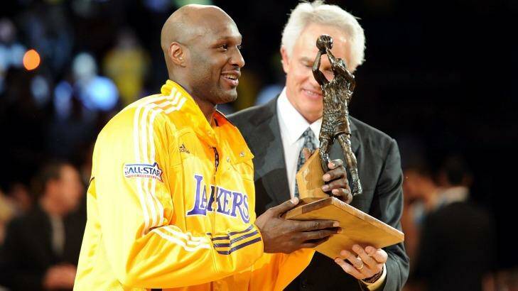 Talented player: Lamar Odom of the Los Angeles Lakers receives the Six Man of the Year Award from Lakers General Manager Mitch Kupchak before game two of the 2011 Western Conference playoff series. Photo: Harry How