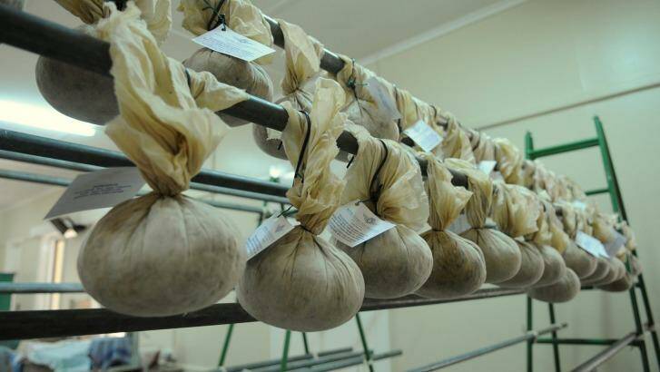 After being boiled, each pudding must be dried in a calico bag, which are made by members of the auxiliary in the months leading up to the annual boil. Photo: Supplied