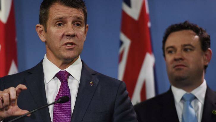 Premier Mike Baird and Sports Minister Stuart Ayres when they announced the $1.6 billion stadium plan last September, elements of which continue to change. Photo: Nick Moir