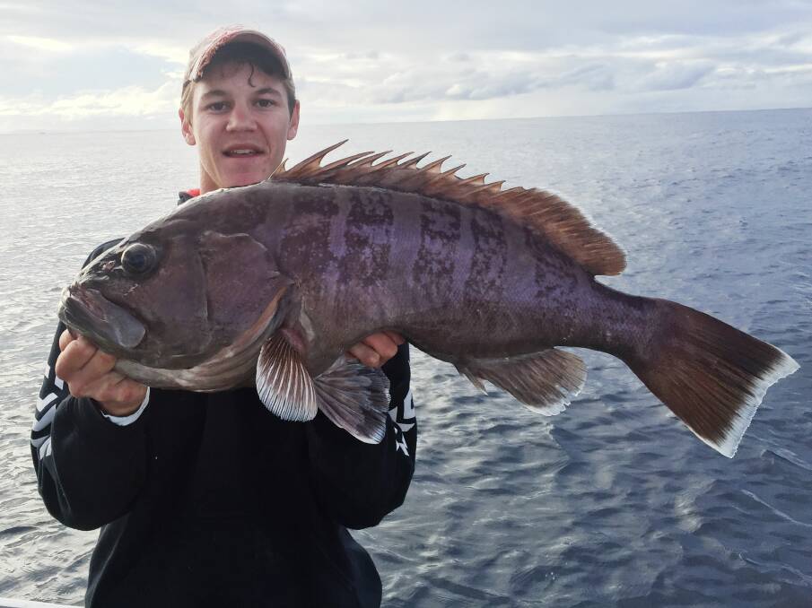Matthew "Macca" McEwan from Fishing Tackle Australia with a Bar Cod from the deep.
