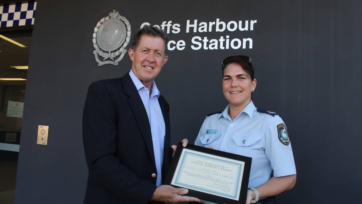 Federal Member for Cowper Luke Hartsuyker with Coffs Harbour Senior Constable Vicky Bamford with a Federal Member’s Award.
