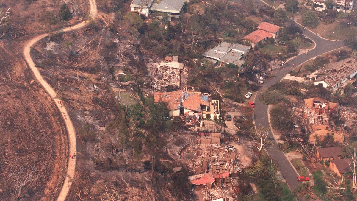 An aerial shot of Canberra the day after fires destroyed more than 500 homes. Photo: JACKY GHOSSEIN