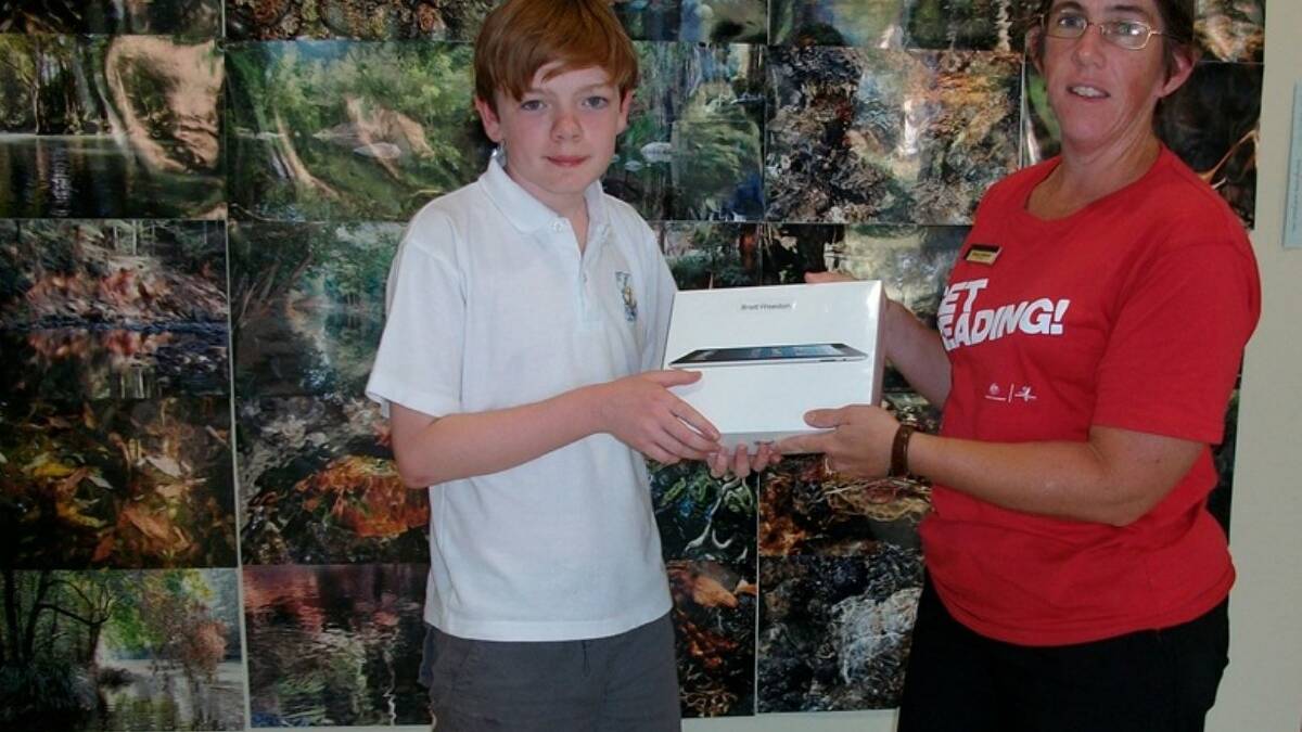 Winner of the library youth survey competition Brett Weedon with Bellingen librarian Sharon.
