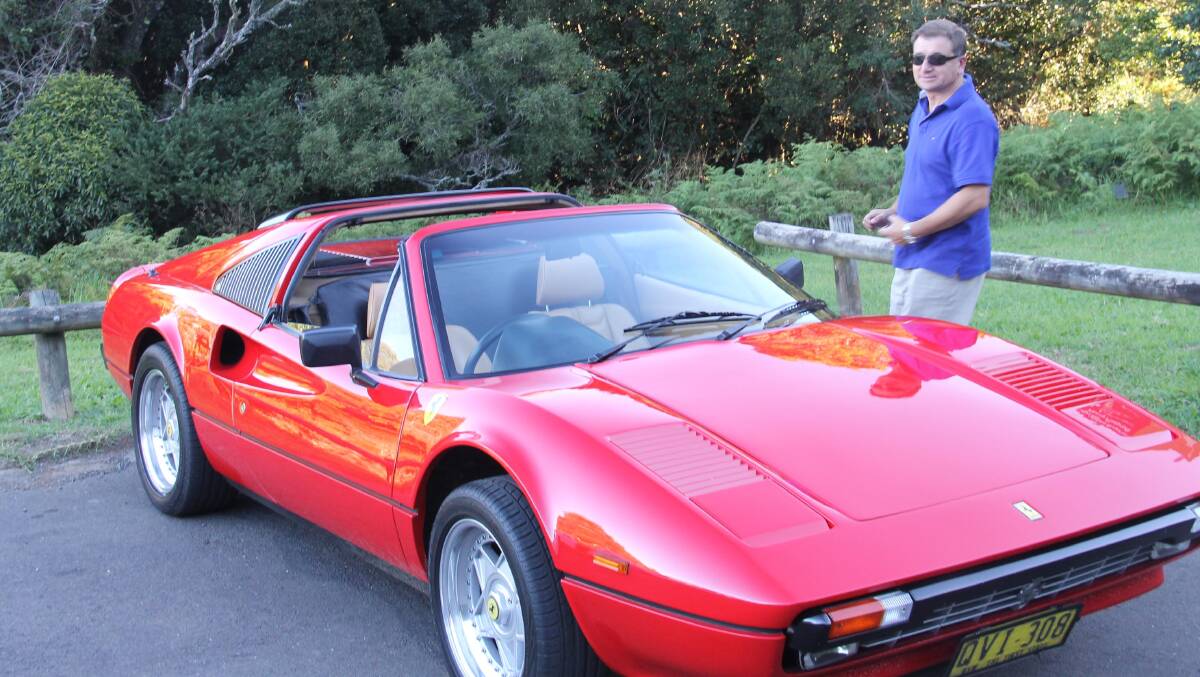 Rob Sciaccittano and his vintage Ferrari sports car … red of course. 
