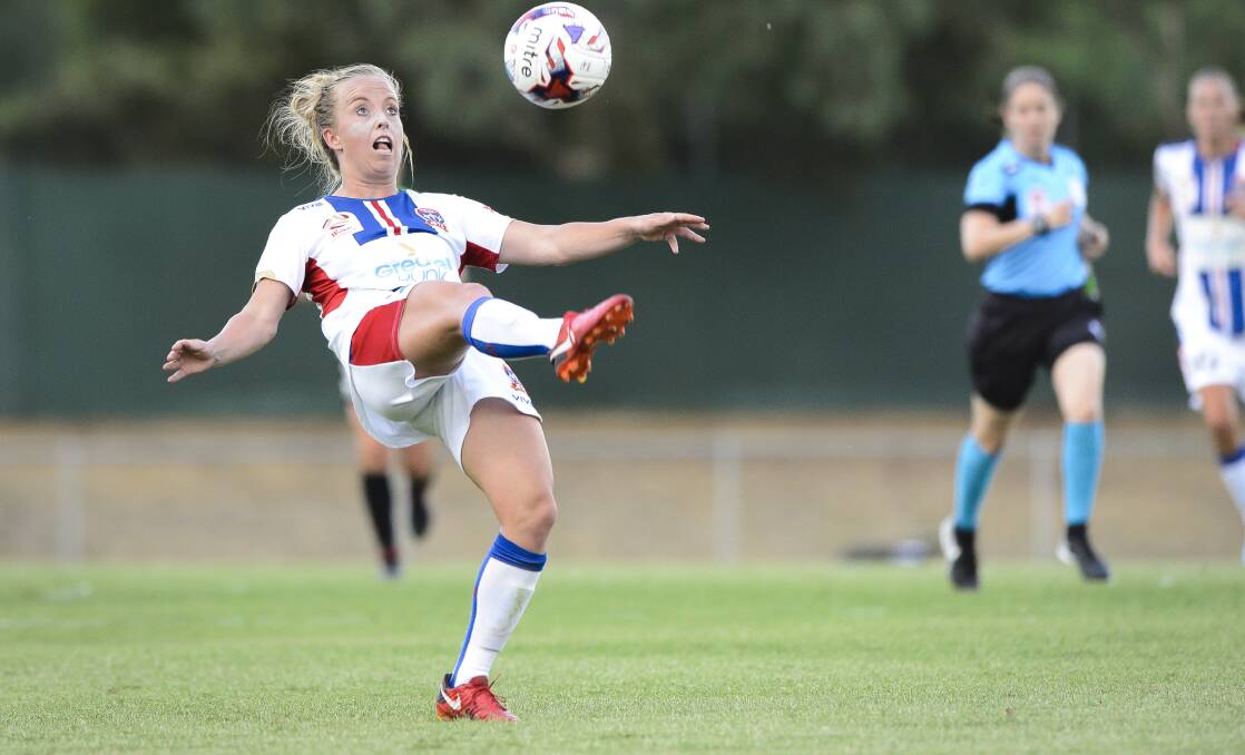 On their way: Newcastle Jets defender Hannah Brewer and the W-League squad will head to the Mid North Coast in October. Photo: Sitthixay Ditthavong
