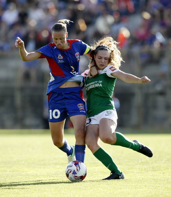 Emily van Egmond of the Jets competes for the ball with Grace Maher. Photo: AAP/Darren Pateman