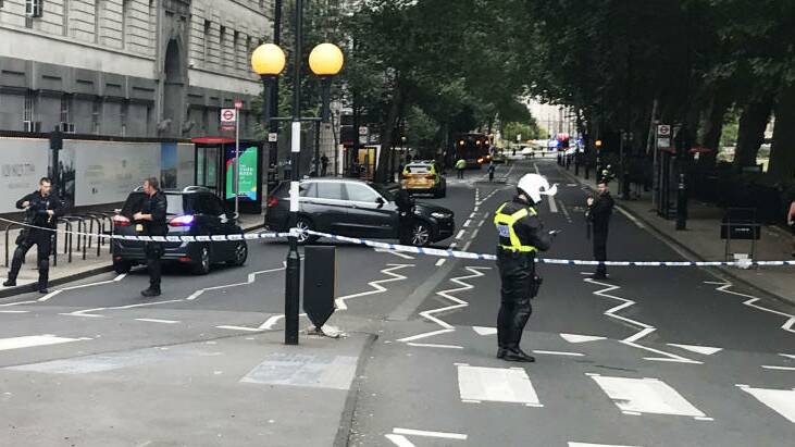 Police activity on Millbank, in central London, after a car crashed into security barriers outside the Houses of Parliament. Photo: Sam Lister/PA Wire