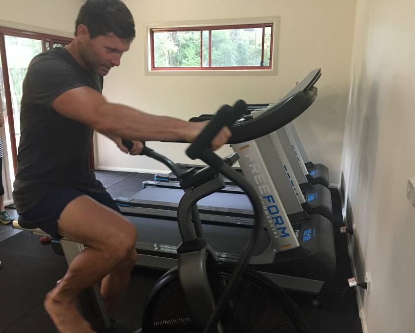 Adrian on a bike at his gym in Raleigh