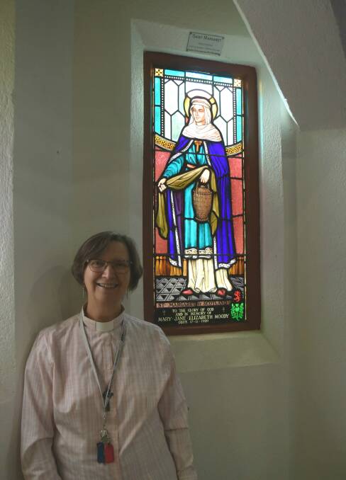 Rev Zoe Everingham next to St Margaret's window