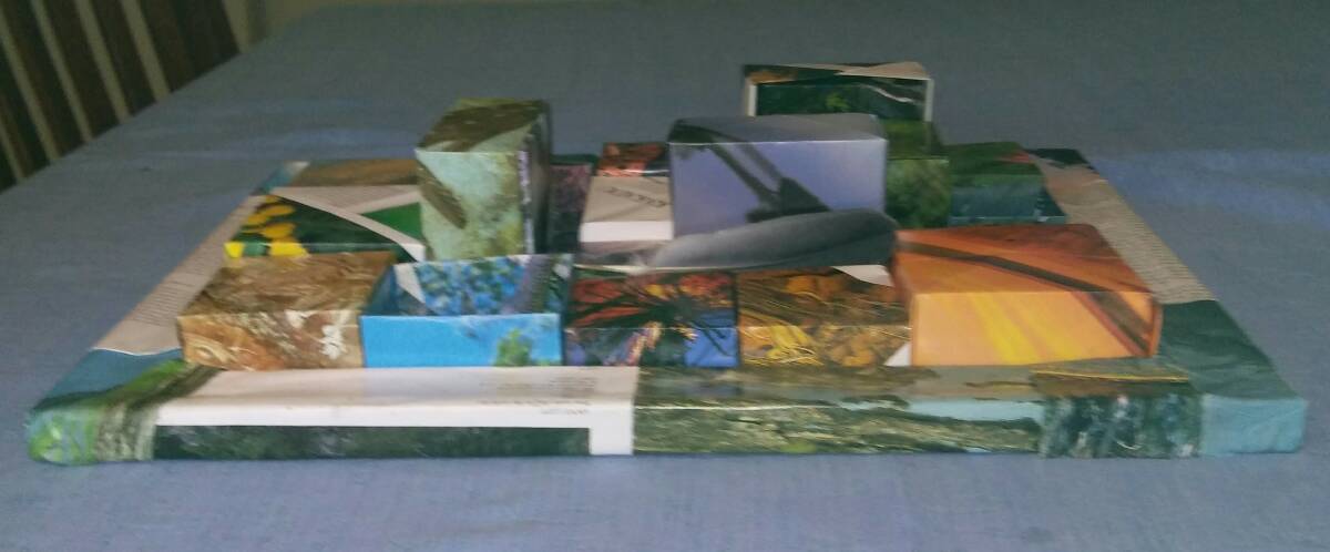 Side view of 3D collage, Kakadu, made from origami boxes using an entire book