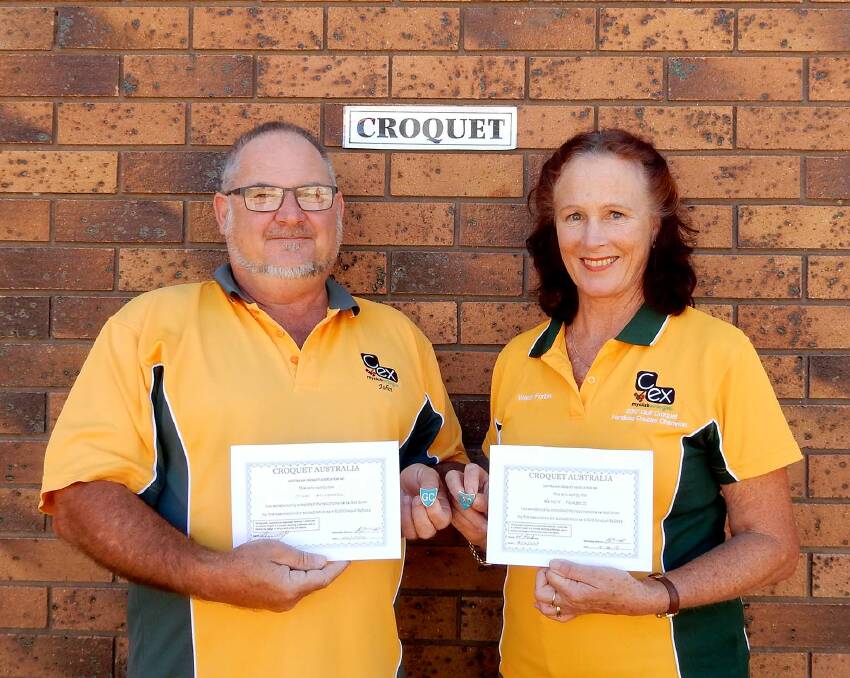 Australian Golf Croquet referees John Mitchell and Wendy Forbes