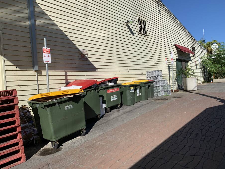 The loading zone on the laneway is also lined with bins