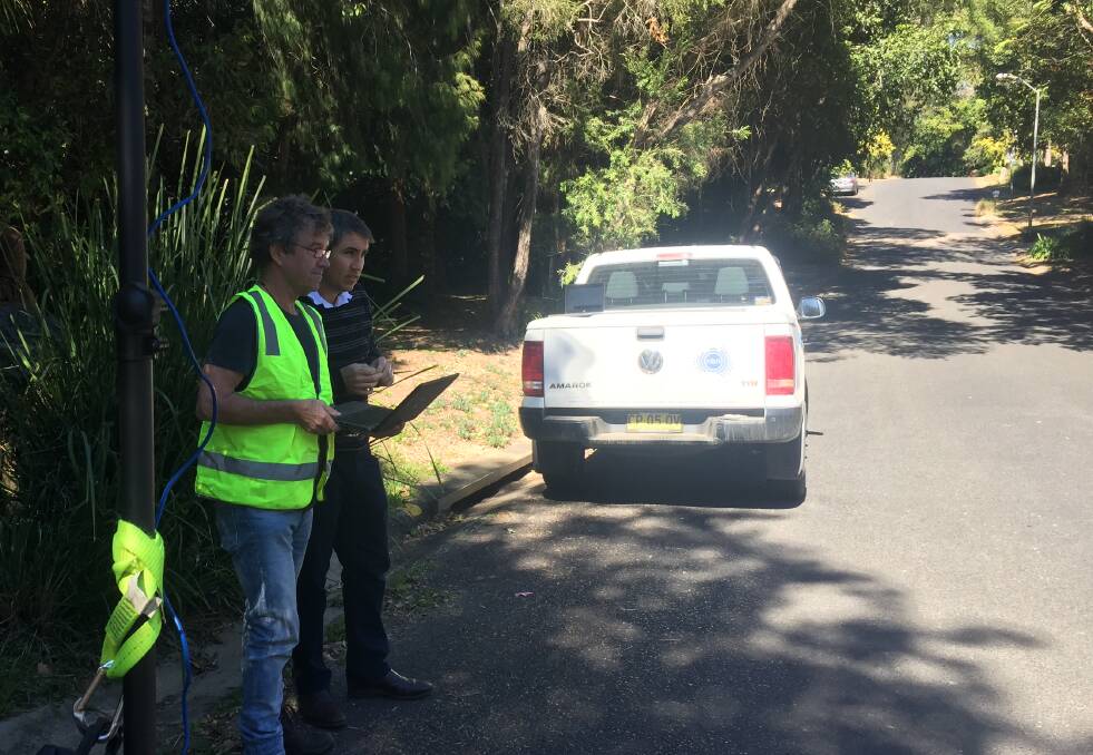 Iain Pick and Ian Scott from NBN at the Sunset Ridge Drive and Hobsons Close intersection