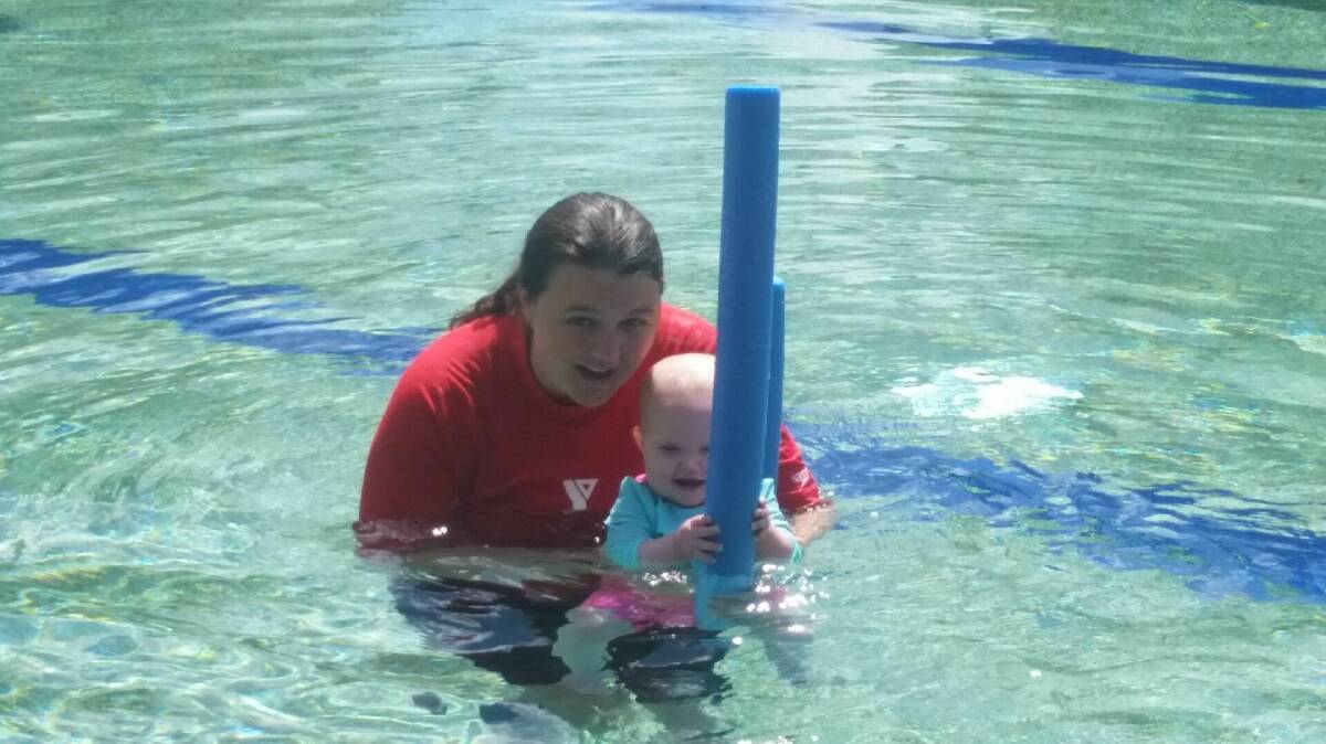 Bellingen Shire Swim Centre coordinator Nicolle Scott with her baby Willow