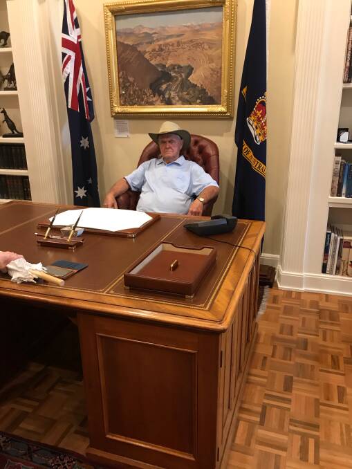 Ron gets to try out Peter's chair at Government House in Canberra 