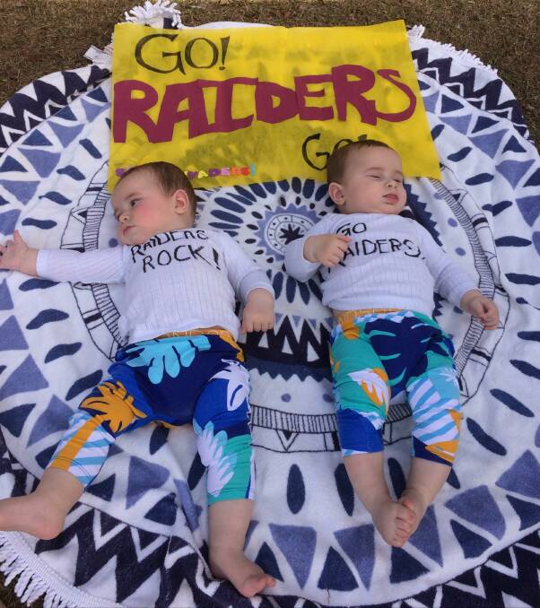 Eli and Iva McGrath showing their support for their sisters playing in the Raiders U12 girls team