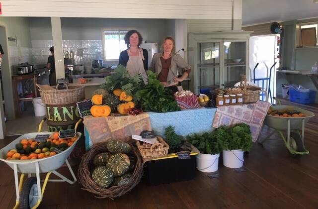 Emily Carden from Kalang Farm Organics and Moss from Bowraville selling amazing produce