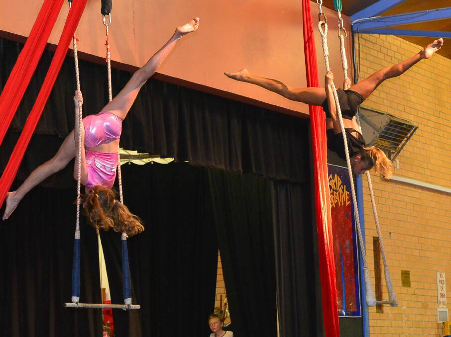 Codi (right), on the trapeze as part of the Spaghetti Circus course she did at the 2019 Camp.