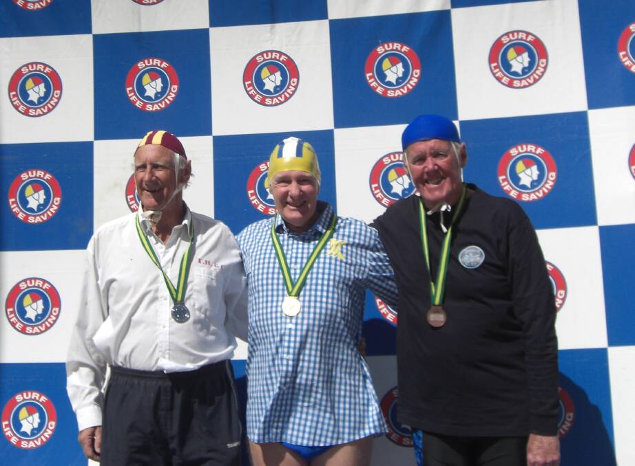 Medallists in the 70yrs+ 100m manikin tow with fins Leslie Large [silver], Peter Allison [gold], Lionel Fargher [bronze] 