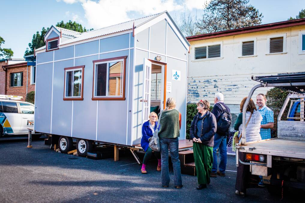 People checking out the tiny home brought by Kim Connoll. Photo Jay Black from And the Trees