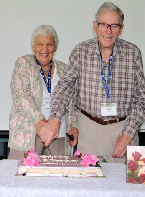 Leona & Bill Scott cutting the birthday cake 
