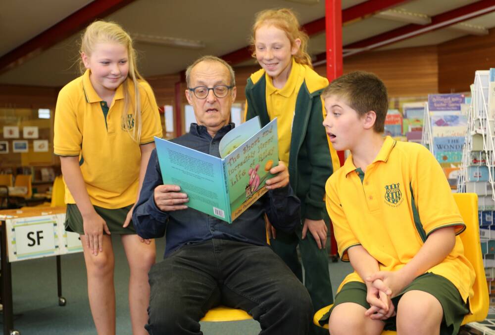 Acclaimed children’s author, Colin Thompson, at Dorrigo Public School with some of his fans, from left: Kahlia Reeves, Ruby Briggs and Danny Masters.