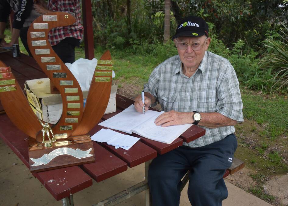 Wal Tyson calculating the Eel Fishing Competition results in 2018