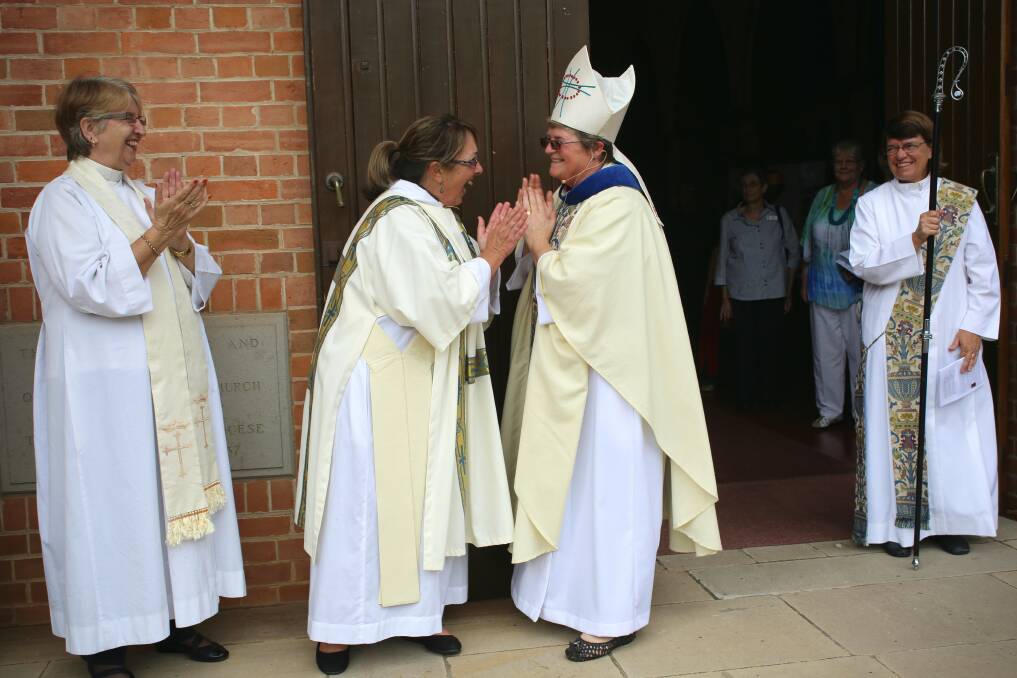 Rev. Anne Goode (centre left) and Bishop Sarah Macneil (centre right) share a laugh. Photo Vivian Hoskins