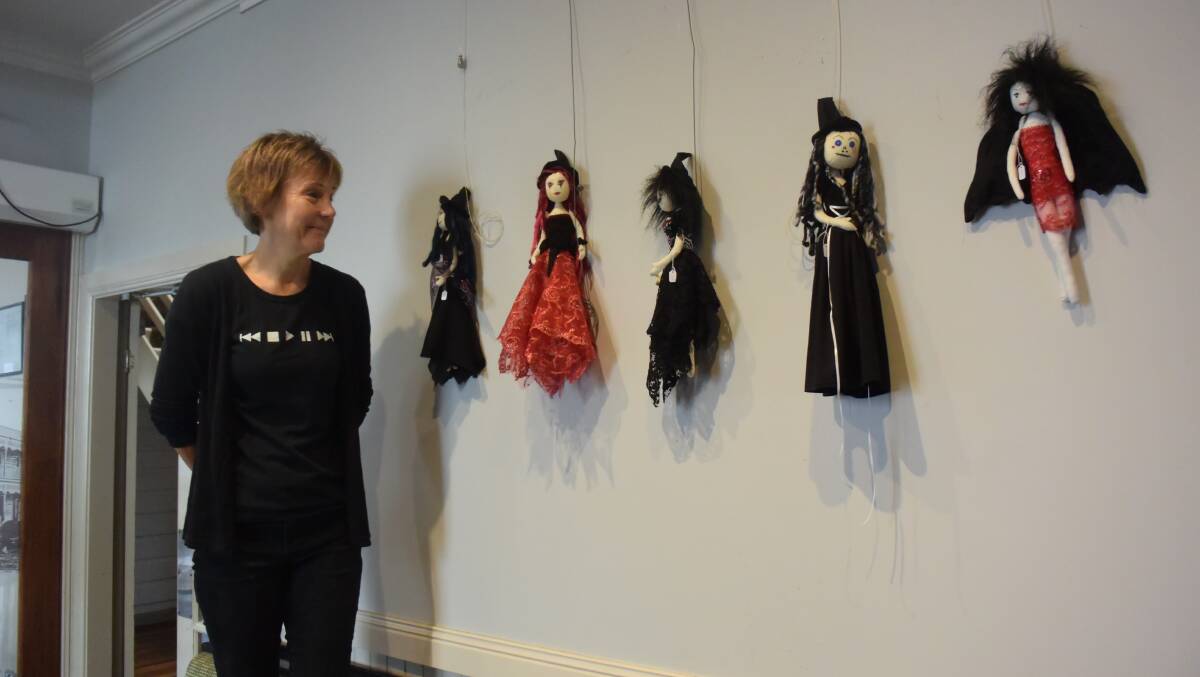 Jackie Lee looks at the slightly sinister ladies on the wall