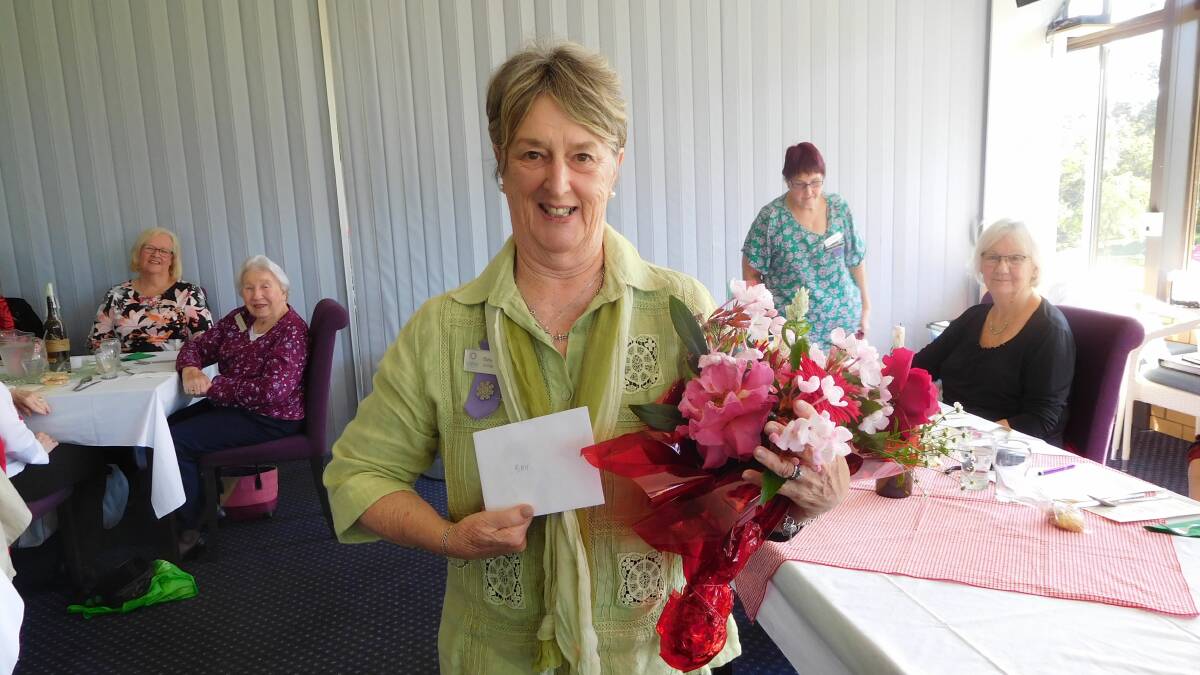 Bev Miles receives a lovely bouquet of flowers for her birthday. Photo: Megan Octigan