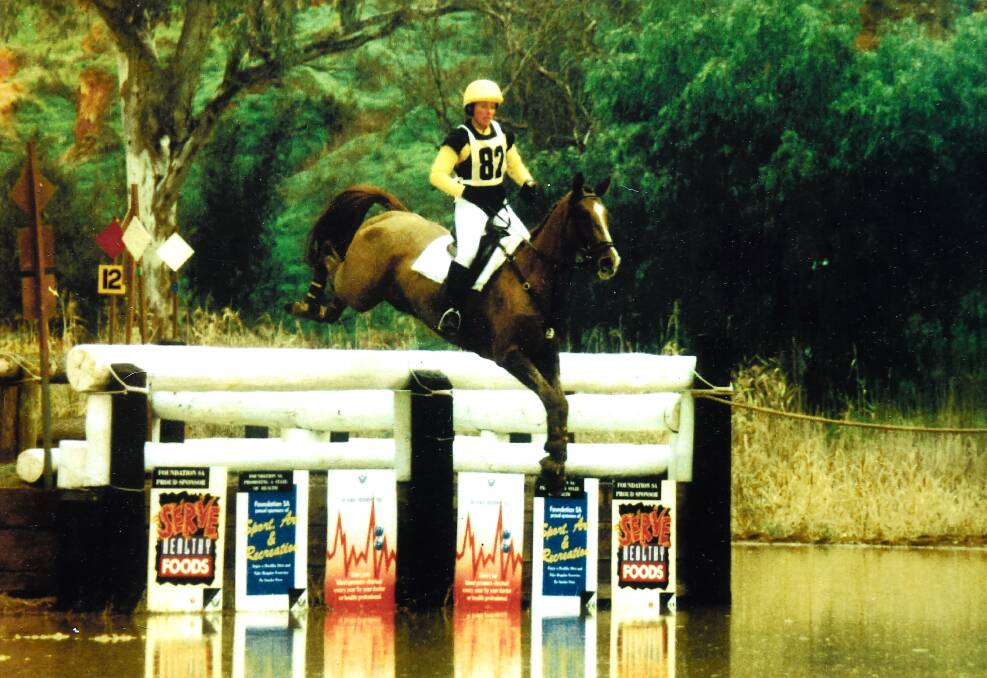 ELITE: Debbie Ross and Studebaker in their heyday tackle a cross country water jump. 