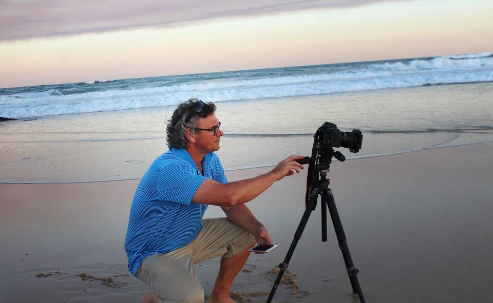 Storm chaser: Ivan Sajko at his favourite spot, Lighthouse Beach in Port Macquarie.