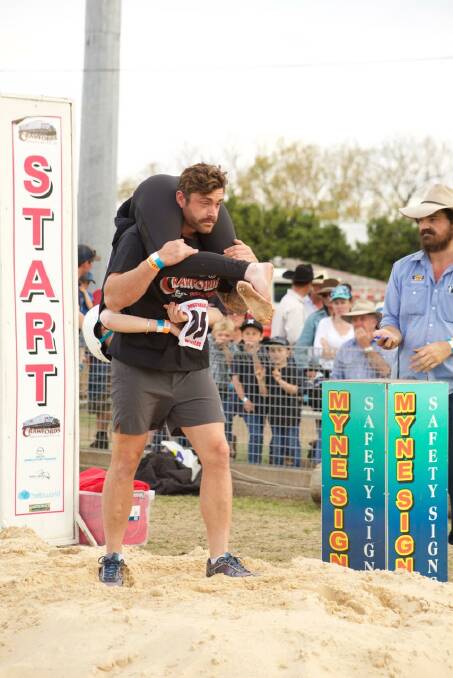 ON YOUR MARKS: Jason is carrying Alana in what is known as the 'Estonian Carry'