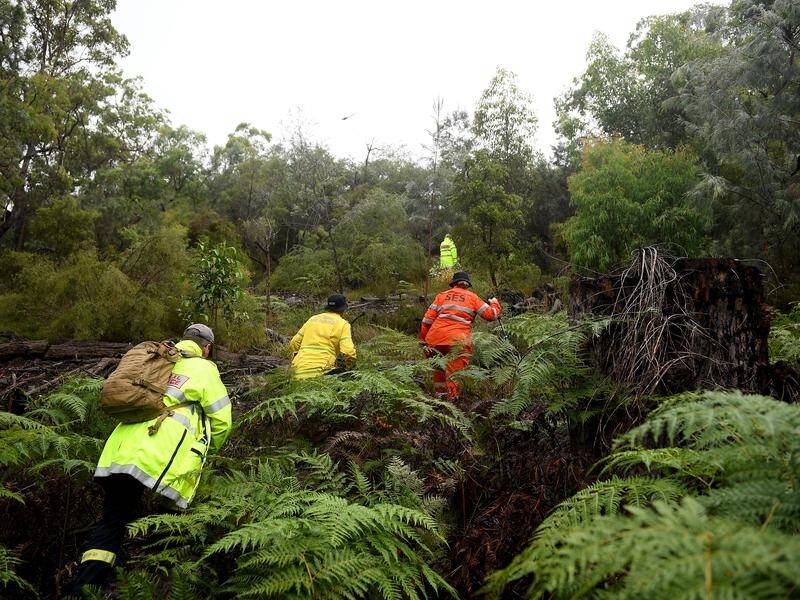 Emergency personnel searched for missing teen Leif Courtney in bushland at Mooney Mooney, NSW.