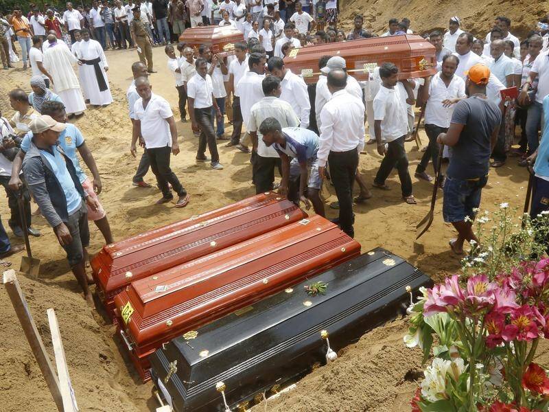 Sri Lankans have begun burying the victims of the Easter Sunday bombs as IS claimed responsibility.