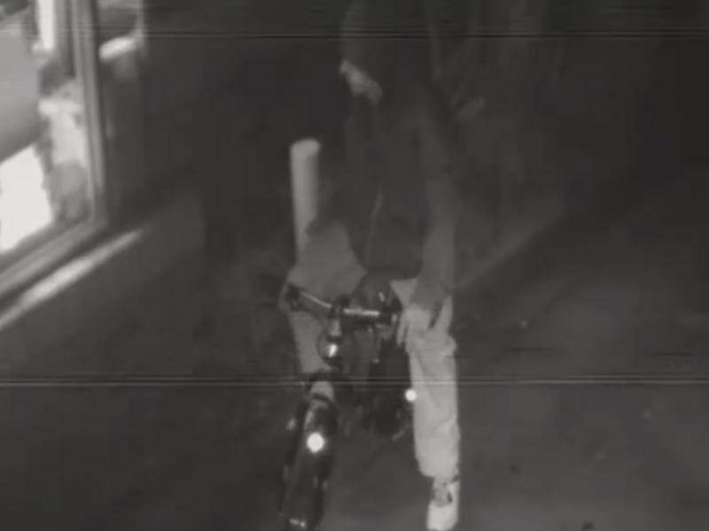 A man on a bicycle has robbed a McDonald's restaurant at gunpoint in Melbourne.