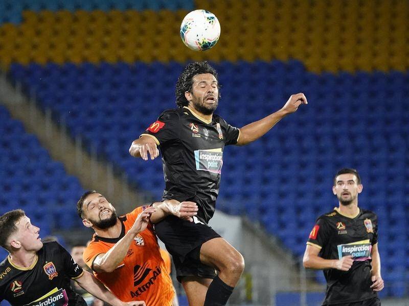Jets' Nikolai Topor-Stanley clears for the Jets in the A-League defeat to Brisbane Roar.