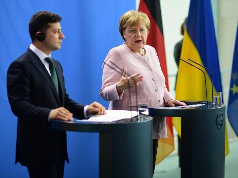 German Chancellor Angela Merkel (R) is meeting Ukrainian President Volodymyr Zelensky in Berlin.