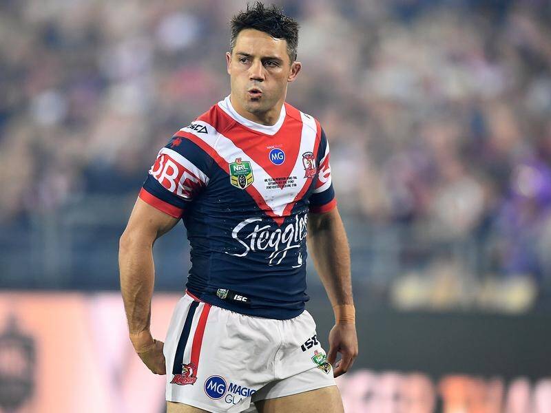 Cooper Cronk played in the Sydney Rosters' NRL grand final win with a fractured left scapula.