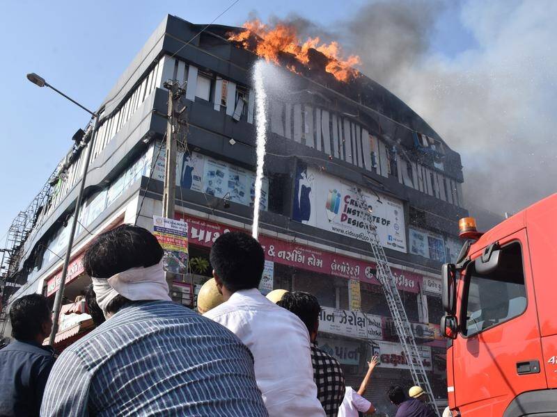At least 20 young people died when a building housing a tuition centre caught fire in Surat, India.