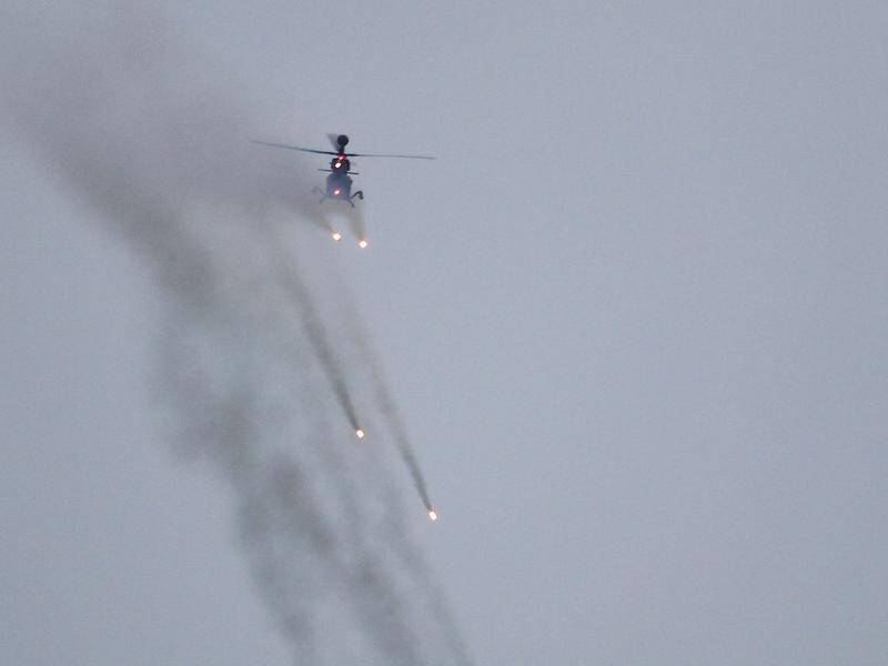 A Taiwanese attack helicopter fires during military exercises.