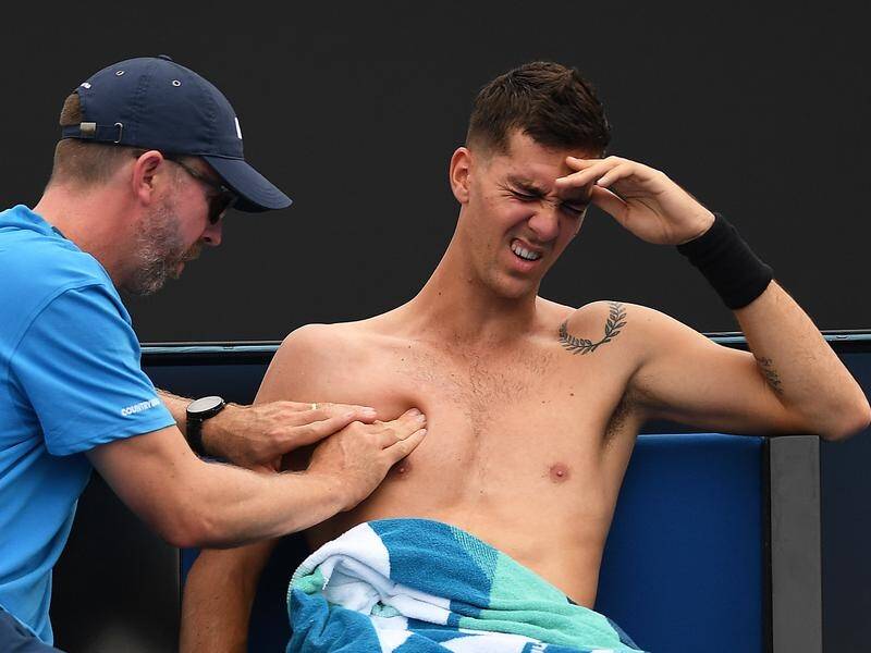 An injured Thanasi Kokkinakis has been forced to withdraw from his Australian Open first round.